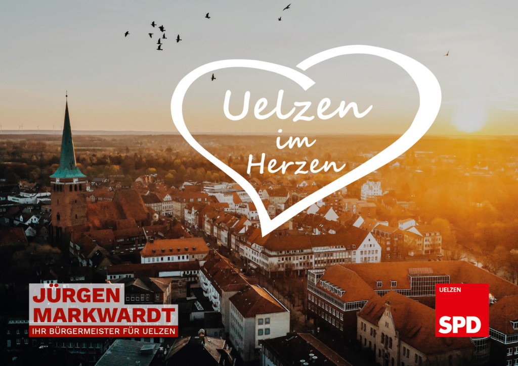 Auf dem Bild ist eine Luftaufnahme der Stadt bei Sonnenuntergang zu sehen. Als Text steht dort in einem Herz: Uelzen im Herzen. Darunter dann Jürgen Markwardt und das SPD-Logo.